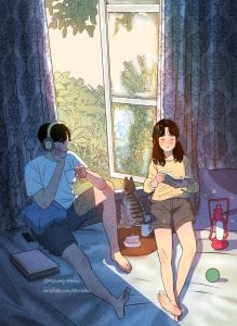 Couple relaxing at home, listening to music and reading. Peaceful scene.