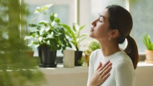 Woman practising calm breathing exercise — anxiety and panic attack relief