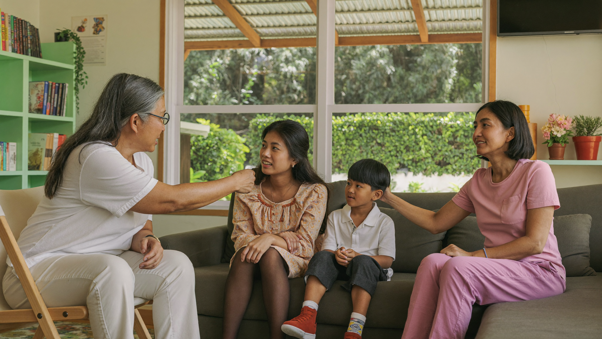 Malaysian family connecting during family therapy session