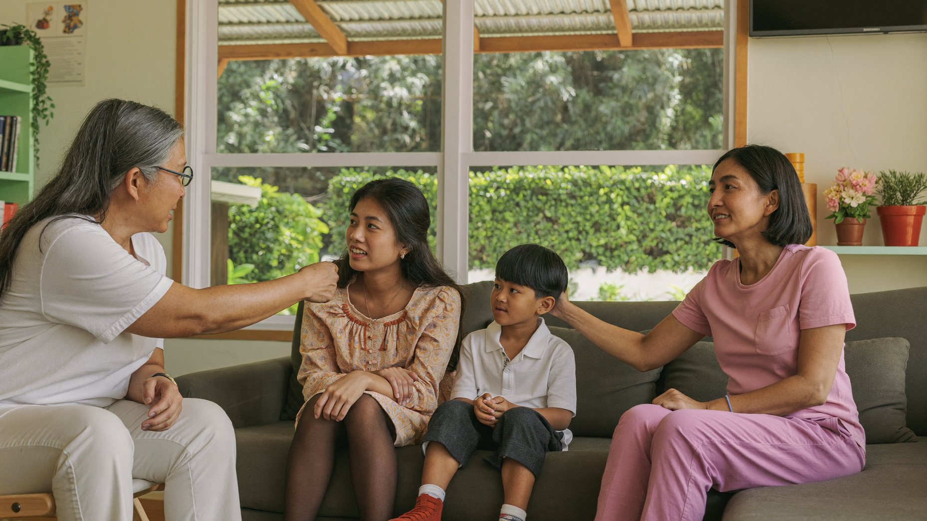Malaysian family connecting during a family therapy session at BeLive in Psychology