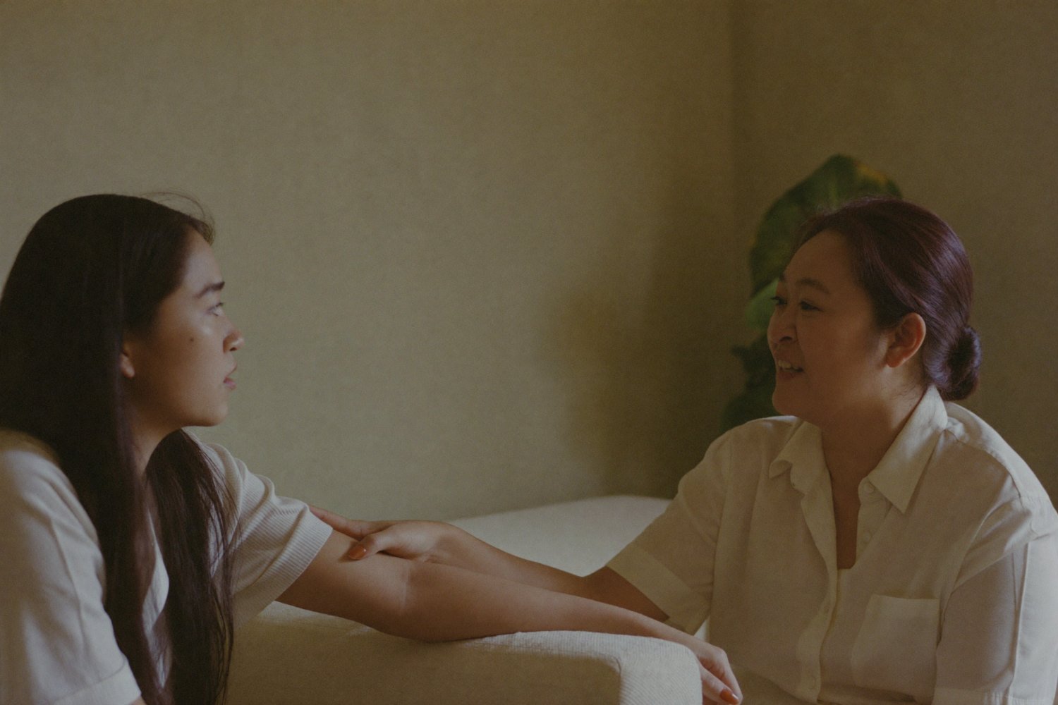 One person listening and offering steady support to another during a grief counselling session